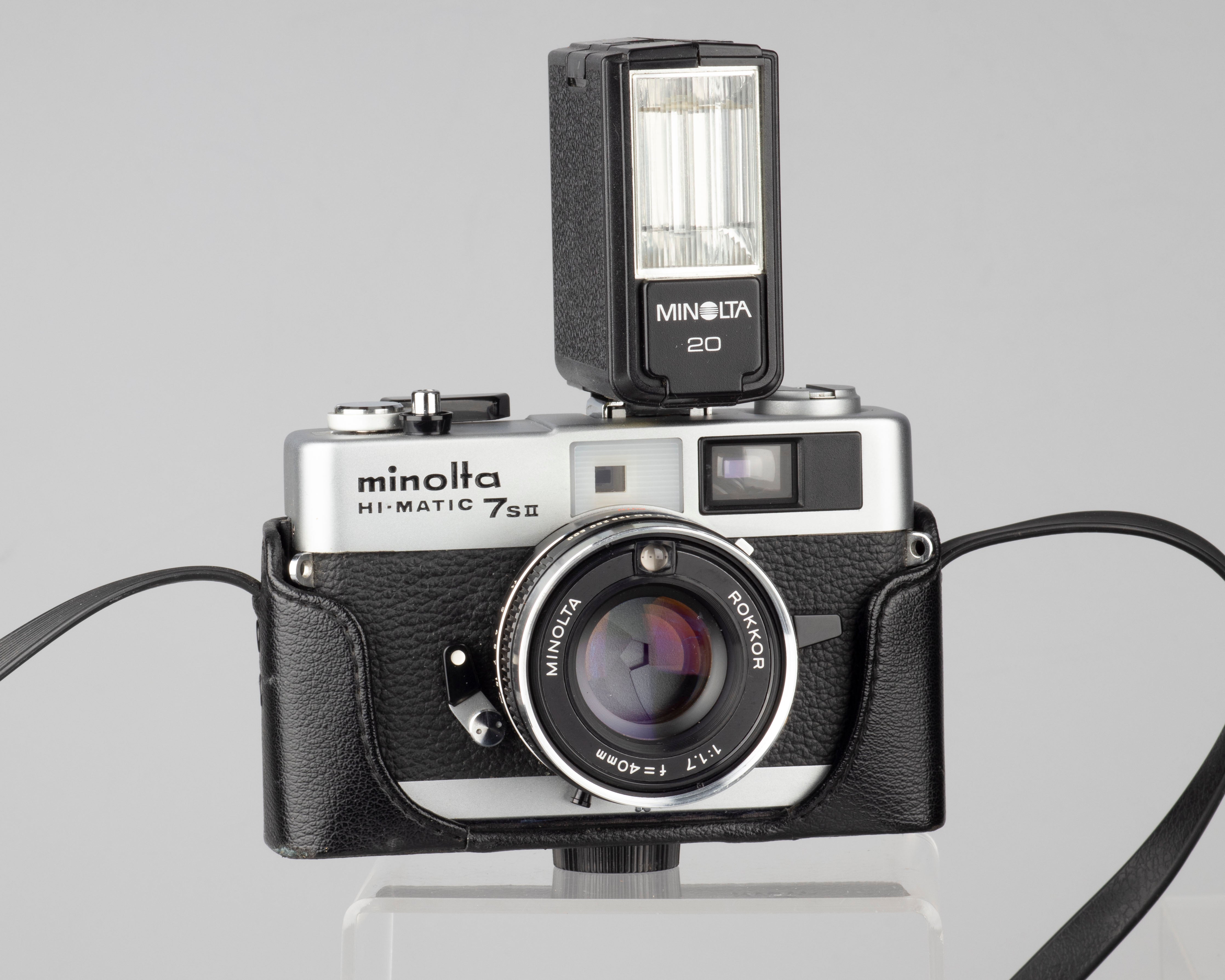 Minolta Hi-Matic 7SII 35mm rangefinder camera with half-case and 