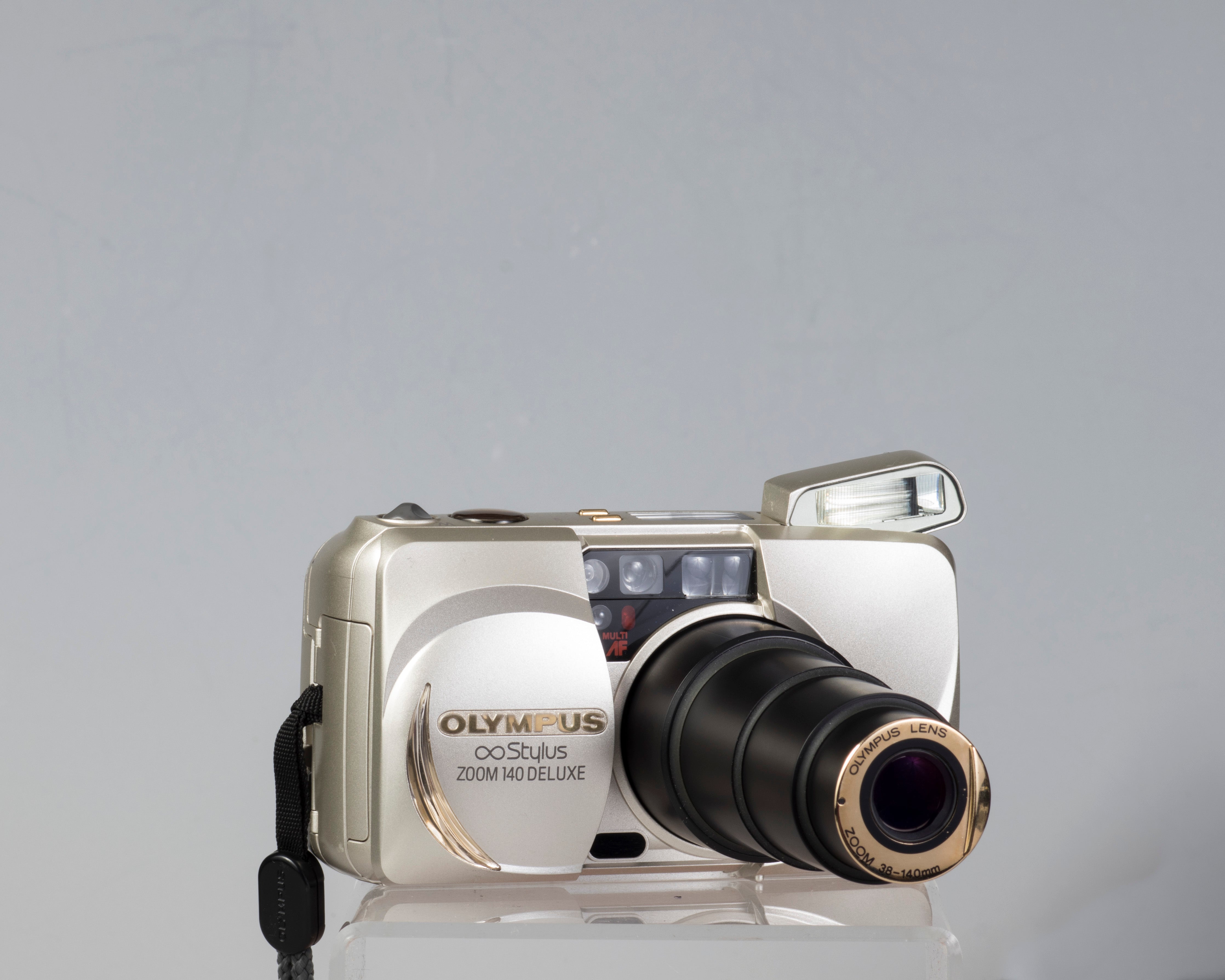 Olympus ∞ Stylus Zoom 140 Deluxe 35mm film camera (serial 4014772)