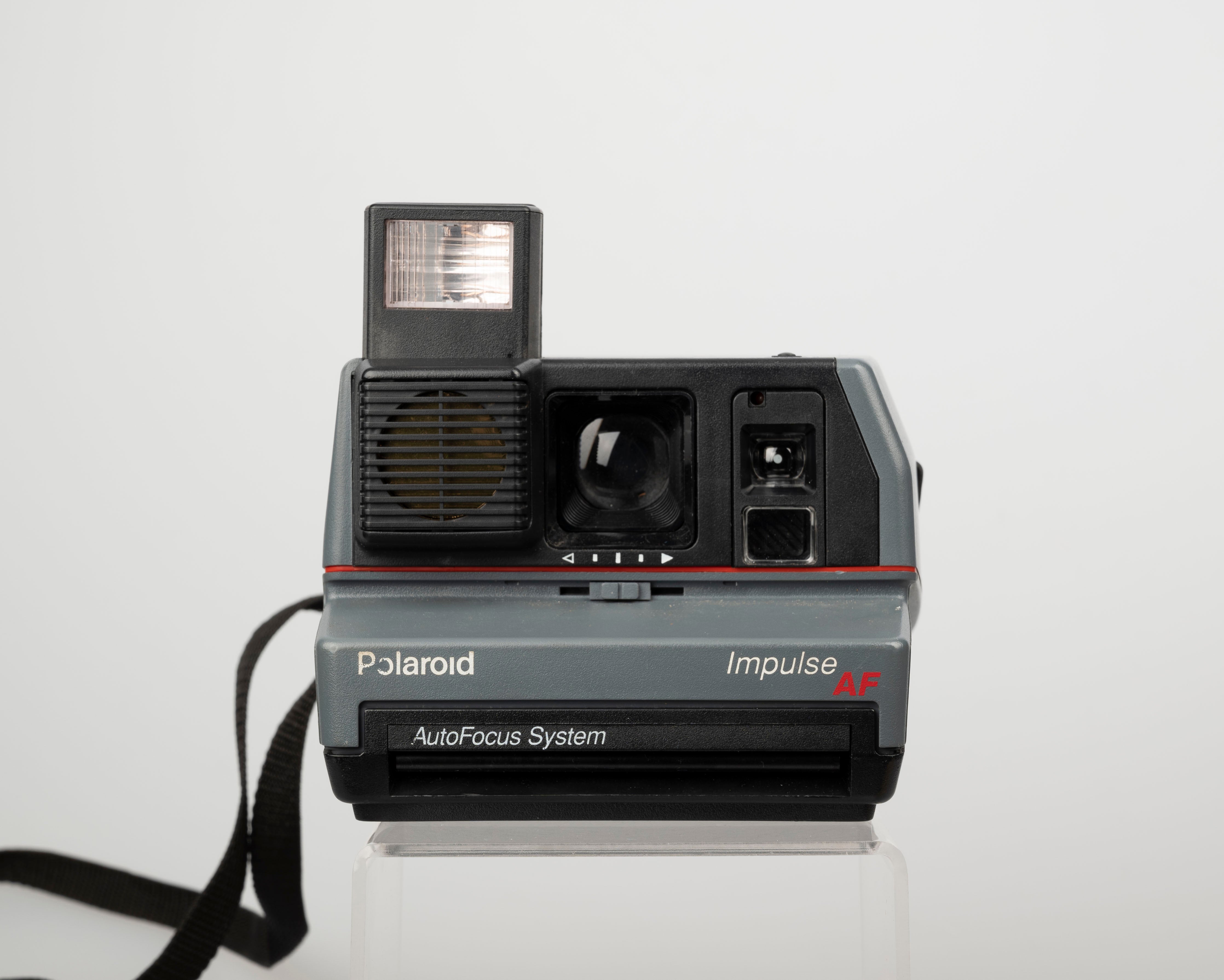 Polaroid Impulse AF instant camera with original case, prism lens filter,  and manual (serial C4K18579YDCA)